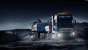 Volvo FH16 700 Heavy Hauler Transporting Excavator at Night in Industrial Quarry HD wallpaper
