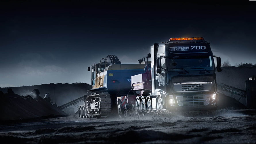Volvo FH16 700 Heavy Hauler Transporting Excavator at Night in Industrial Quarry HD wallpaper
