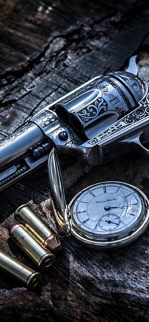 Engraved Silver Revolver with Pocket Watch and Brass Cartridges on Weathered Wood HD phone wallpaper