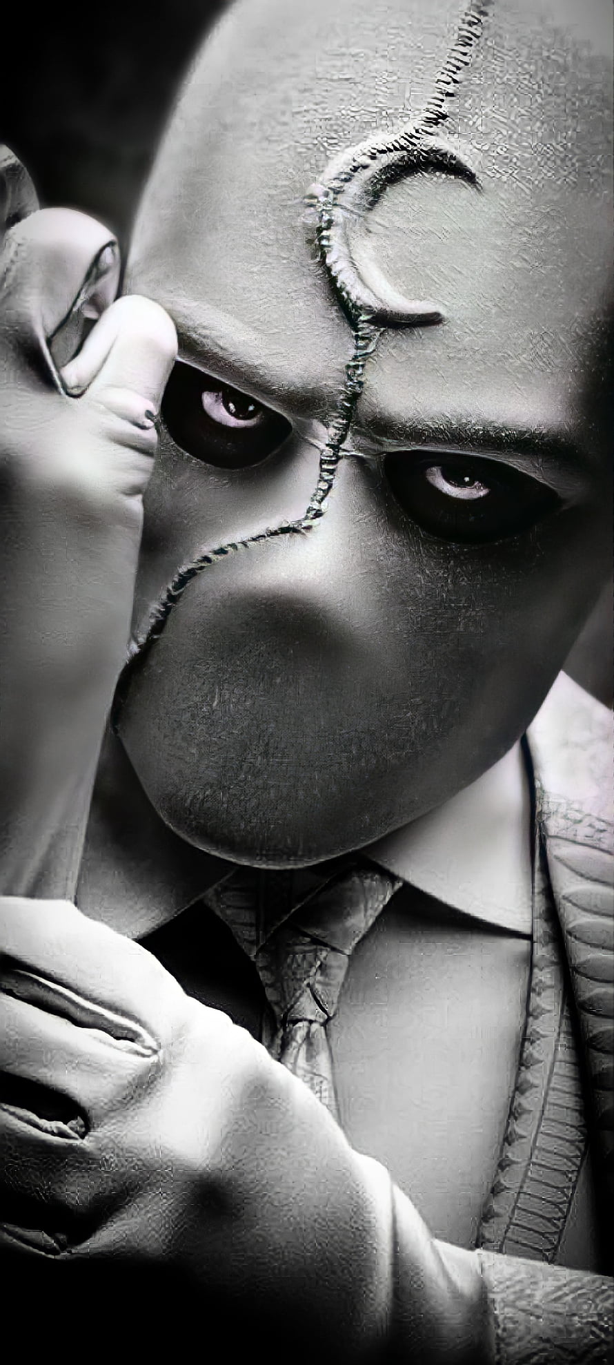 Moon Knight Close-Up Portrait with Stitched Face and Intense Stare in Black and White HD phone wallpaper