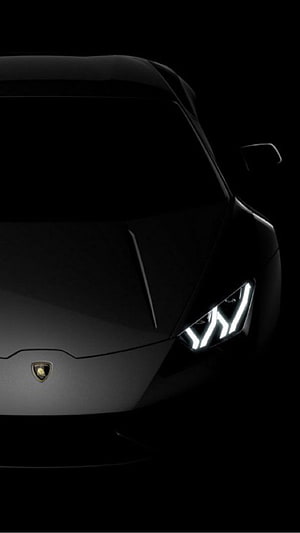 Lamborghini Revuelto Front Headlight Close-Up in Dark Studio Setting HD phone wallpaper