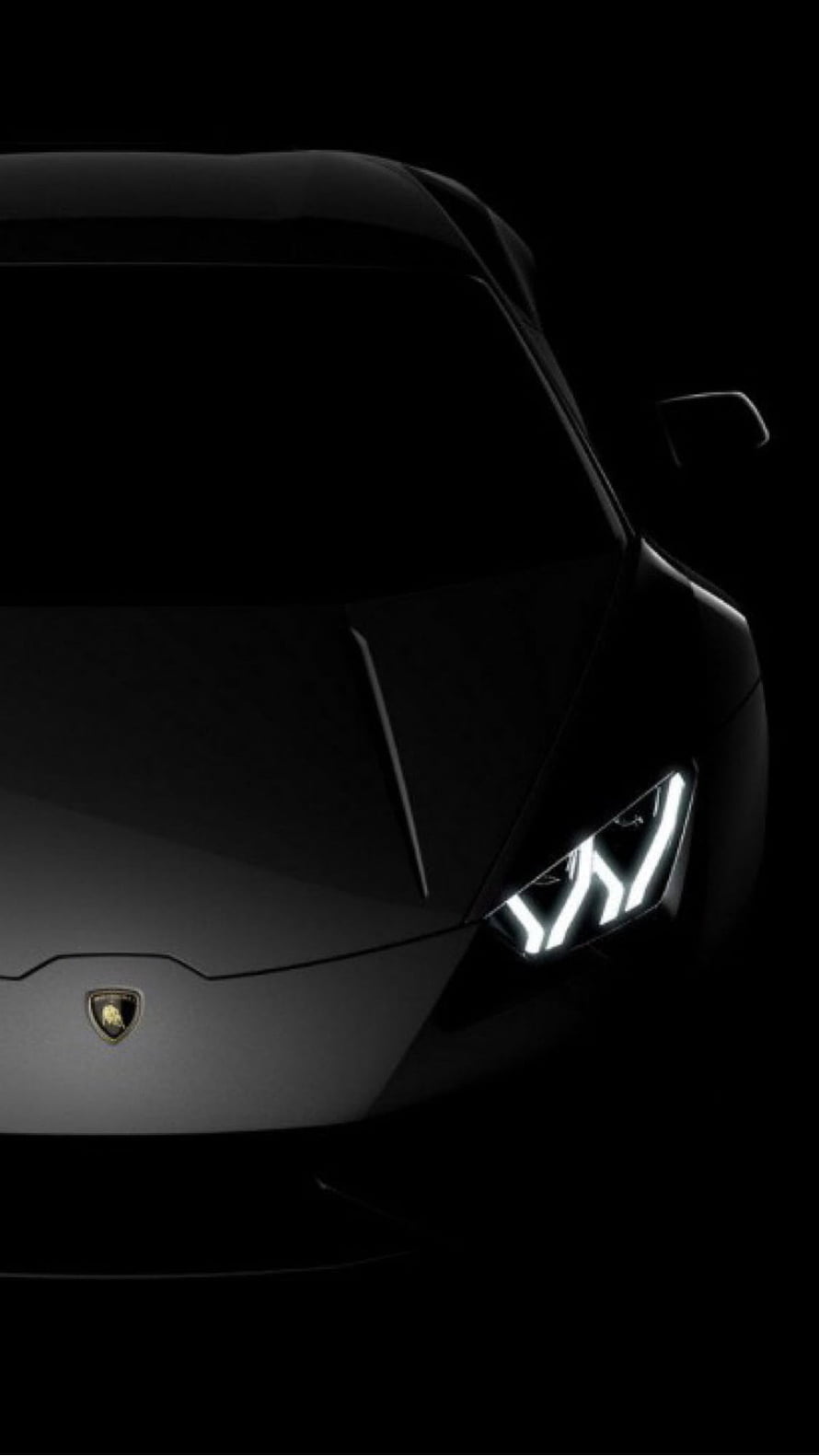 Lamborghini Revuelto Front Headlight Close-Up in Dark Studio Setting HD phone wallpaper