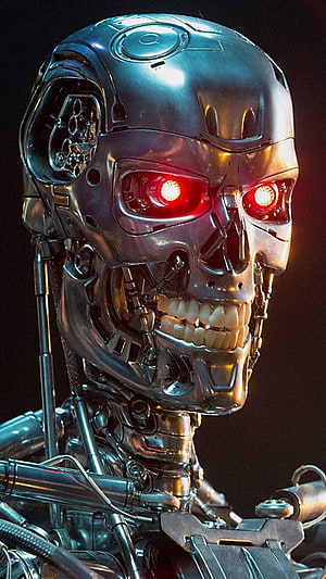 Terminator T-800 Endoskeleton with Glowing Red Eyes and Metallic Chrome Face HD phone wallpaper