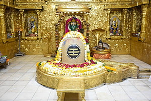 Somnath Mahadev Jyotirlinga Temple Interior with Golden Carvings and Sacred Lingam HD wallpaper
