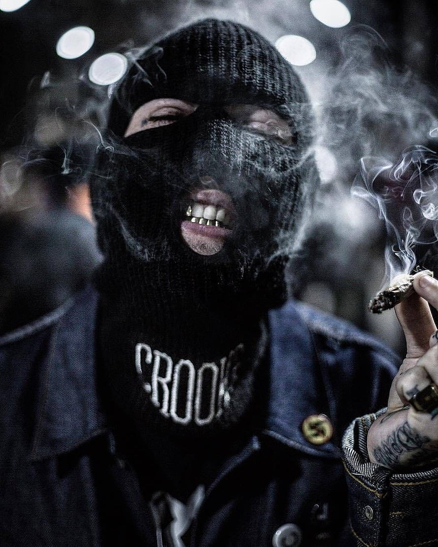 Man in black balaclava smoking a joint with gold grillz and Crooks shirt HD phone wallpaper