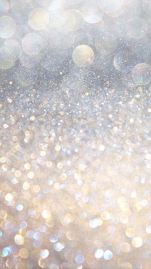 Soft Gold and Silver Glitter Bokeh Background with Shimmering Light Orbs HD phone wallpaper