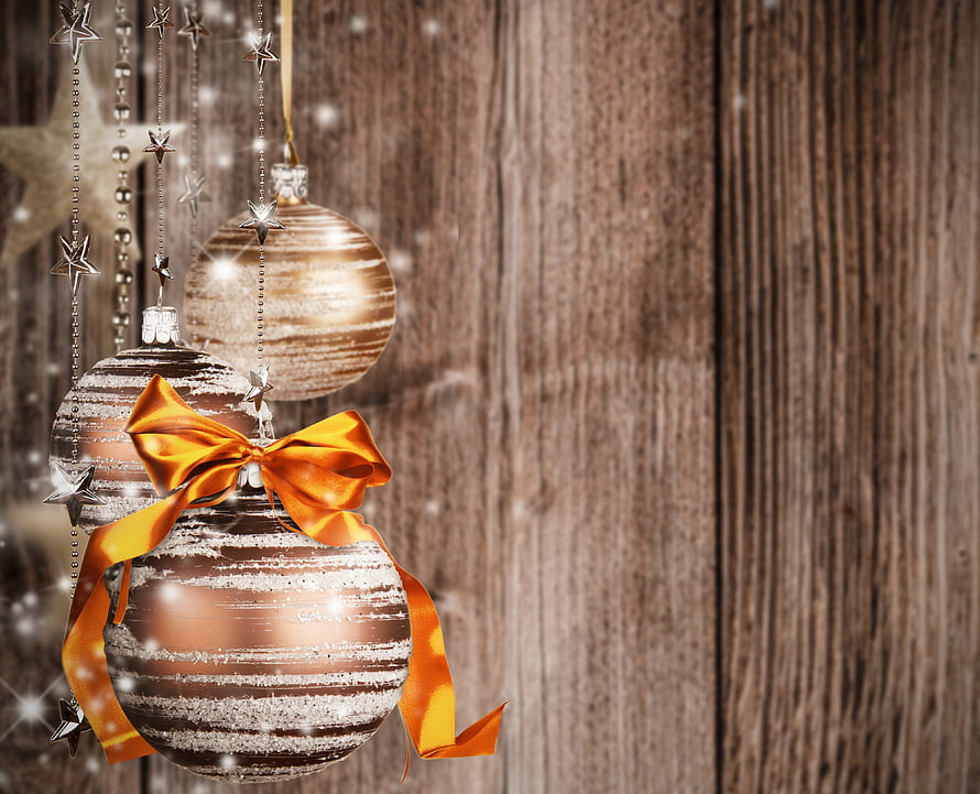 Elegant Gold Christmas Ornaments with Orange Ribbon on Rustic Wood Background HD wallpaper