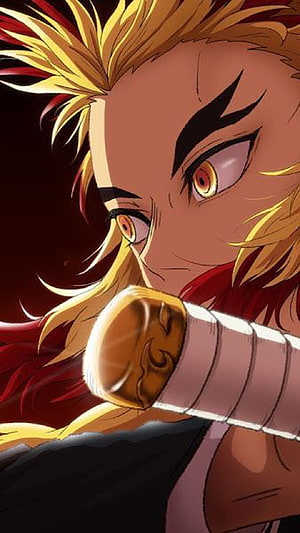 Kyojuro Rengoku from Demon Slayer in Intense Close-Up with Flame-Style Hair and Sword Hilt HD phone wallpaper