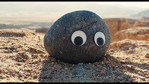 Everything Everywhere All at Once Rock with Googly Eyes in Desert Landscape HD wallpaper