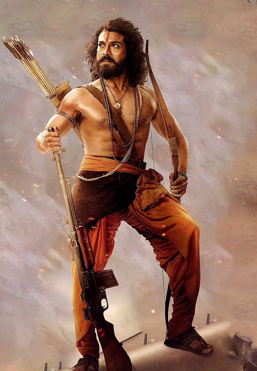 Ram Charan as Alluri Sitarama Raju in RRR with bow and rifle in dramatic warrior pose HD phone wallpaper