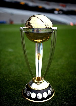 ICC Cricket World Cup Trophy on Green Stadium Pitch HD phone wallpaper