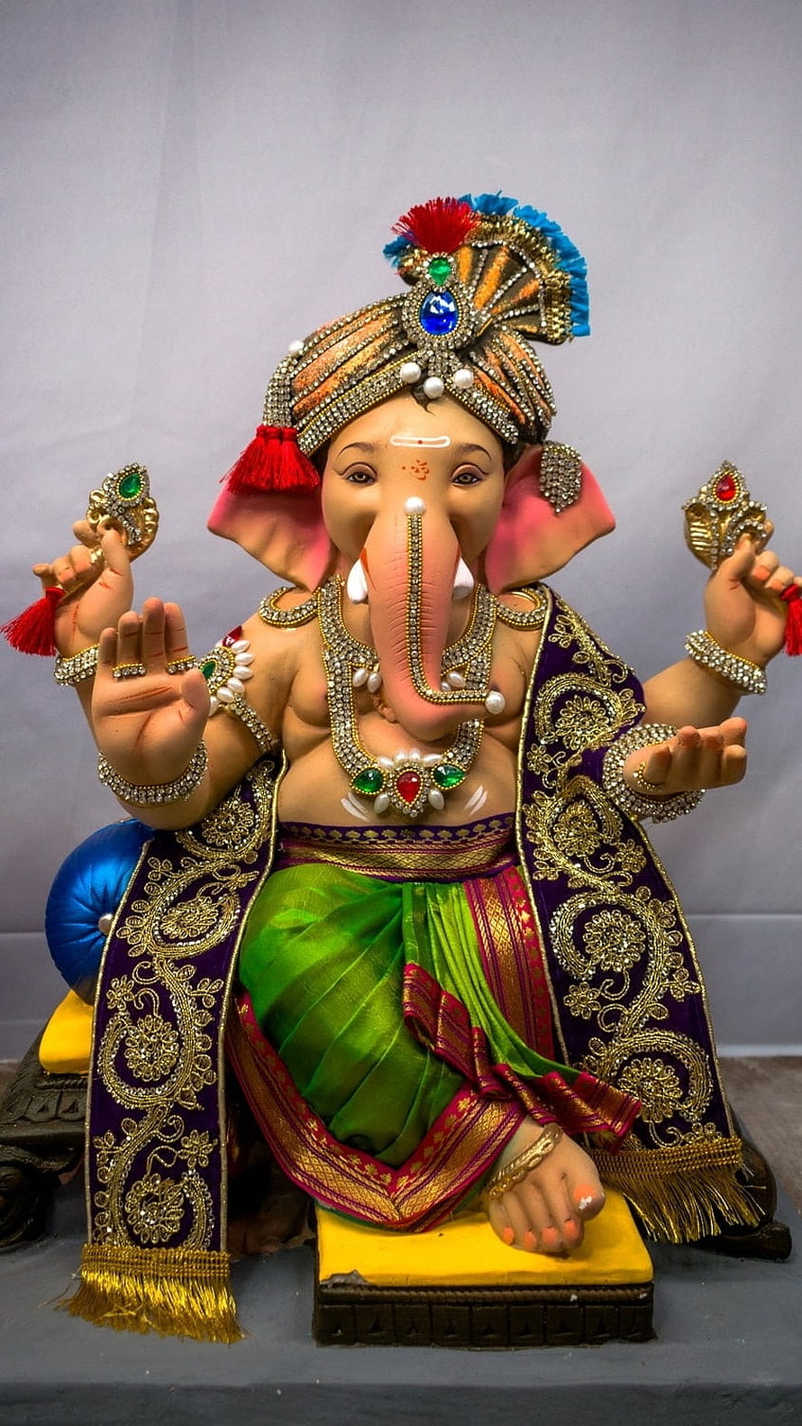 Ornate Bal Ganesha Statue in Traditional Attire with Jewels and Silk Drape HD phone wallpaper