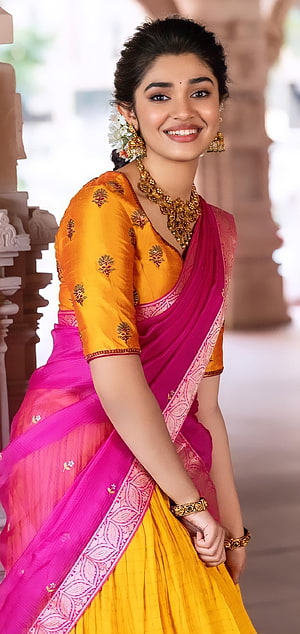 Krithi Shetty in Vibrant Pink and Yellow Silk Saree with Gold Jewelry HD phone wallpaper