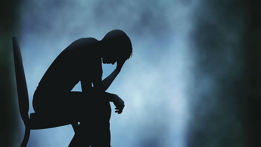 Silhouette of a Person Sitting Alone in a Dark Room Conveying Deep Sadness and Isolation HD wallpaper