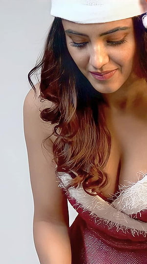 Malavika Sharma in a festive red dress with white fur trim and a white cap HD phone wallpaper