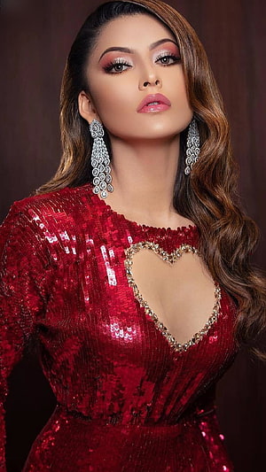 Urvashi Rautela in a Sparkling Red Sequined Gown with Heart Cutout and Diamond Earrings HD phone wallpaper