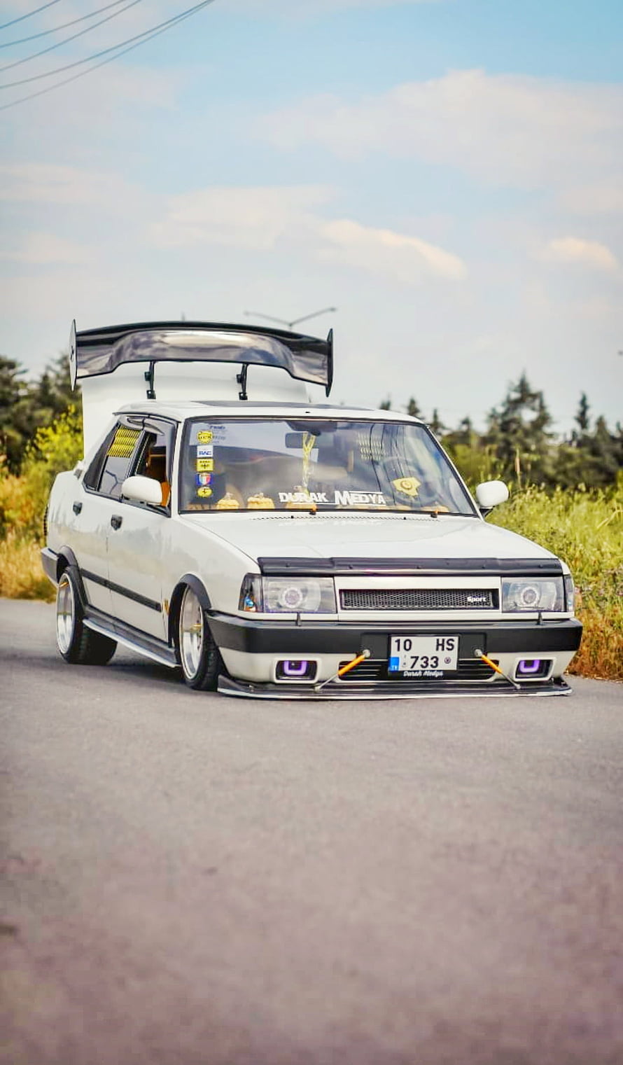 White Tofas Sedan with Large Rear Wing and Stance Setup on Country Road HD phone wallpaper