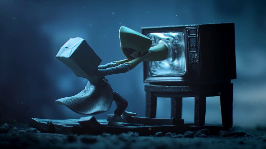 Monochromatic stop-motion diorama of a hooded figure reaching into a vintage television set HD wallpaper