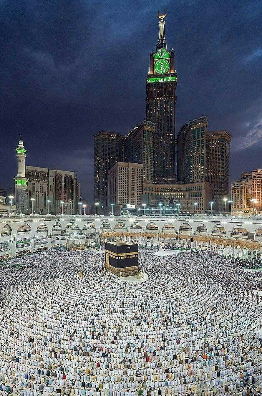 Kaaba and Makkah Clock Tower at Night with Pilgrims in Tawaf Circles HD phone wallpaper