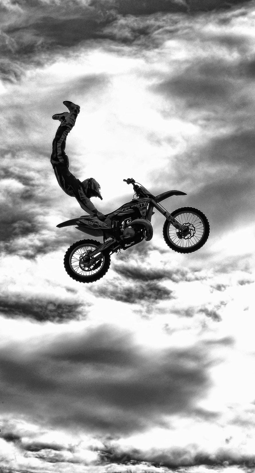 Black and White Motocross Rider Performing Aerial Stunt on KTM Dirt Bike HD phone wallpaper