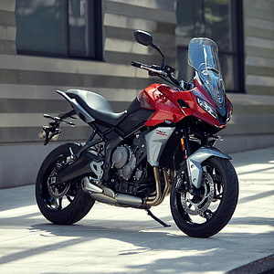 Red Triumph Tiger Sport 660 Motorcycle Parked on Urban Sidewalk HD phone wallpaper