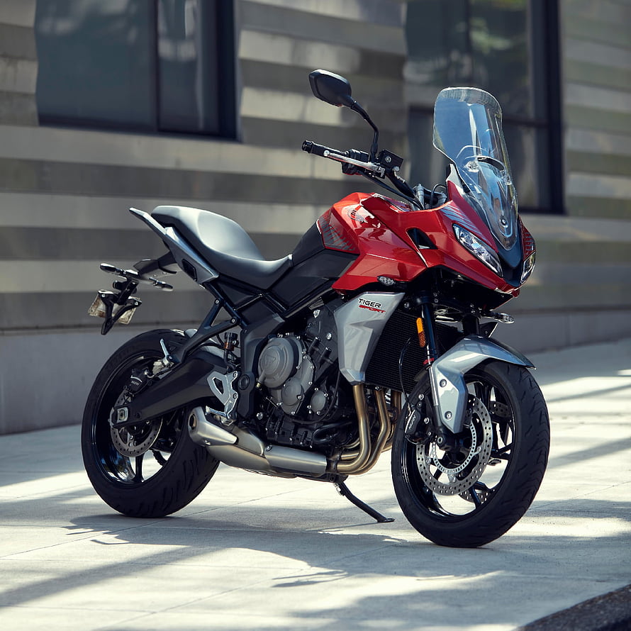 Red Triumph Tiger Sport 660 Motorcycle Parked on Urban Sidewalk HD phone wallpaper