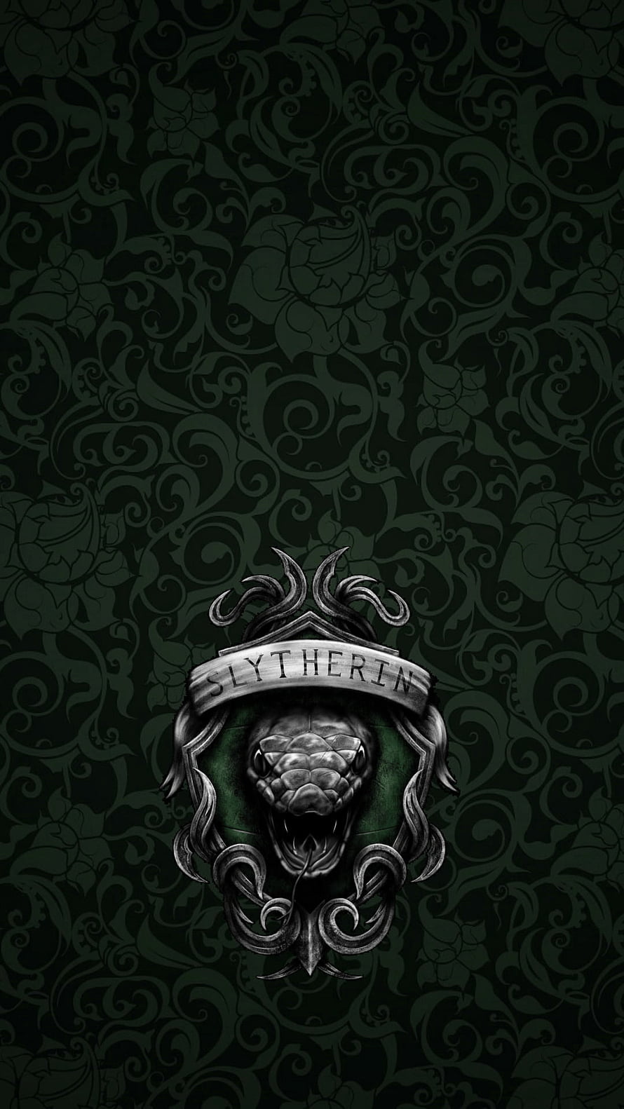 Slytherin House Crest with Ornate Snake Emblem on Dark Floral Background HD phone wallpaper