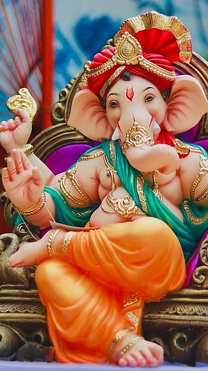 Ornate Ganesha Idol Wearing Red Turban and Gold Jewelry on Carved Throne HD phone wallpaper