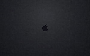 Minimalist Apple Logo on Dark Textured Surface HD wallpaper
