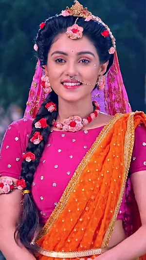 Radha in Traditional Indian Attire with Floral Hair Braid and Saree HD phone wallpaper