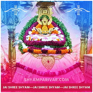 Khatu Shyam Ji adorned with vibrant floral garlands and traditional temple decorations HD phone wallpaper