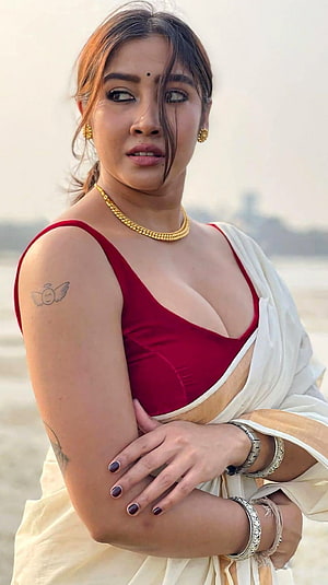 Sophia in a red blouse and cream saree with gold jewelry and a winged tattoo on her shoulder HD phone wallpaper