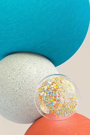 Abstract geometric composition with colorful spheres and pastel sprinkles on a neutral background HD phone wallpaper