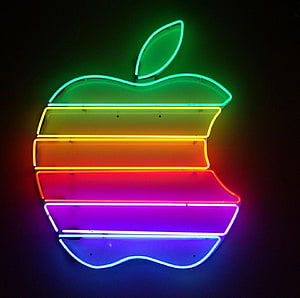 Vibrant Rainbow Neon Apple Logo Sign Against Dark Background HD wallpaper