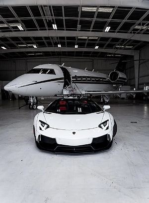 White Lamborghini Aventador SVJ Parked in Hangar with Private Jet HD phone wallpaper