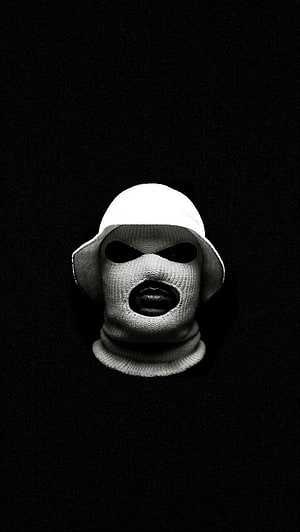 Monochrome Portrait of a Figure in a Knitted Balaclava and Bucket Hat HD phone wallpaper