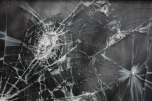 Shattered Glass Texture with Radiating Fracture Lines and Impact Points HD wallpaper