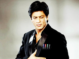 Shah Rukh Khan in a black tuxedo with colored pens in his pocket HD wallpaper