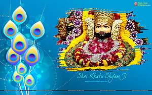 Khatu Shyam Ji adorned with vibrant floral garlands and traditional ornaments on a blue background HD wallpaper