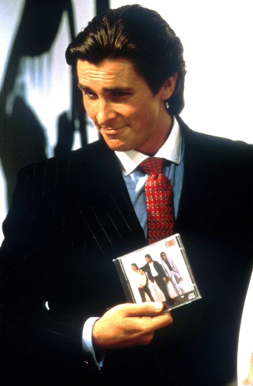 Christian Bale as Patrick Bateman in American Psycho holding a CD, View Christian Bale American Psycho , Patrick Bateman HD phone wallpaper