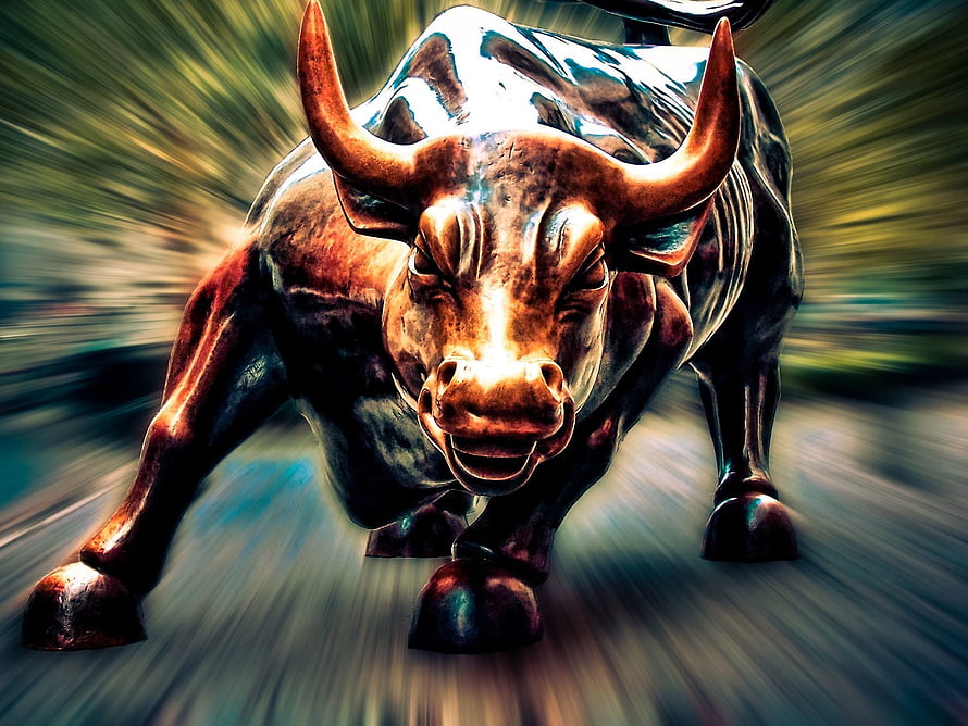 Aggressive Bronze Bull Statue Charging Forward With Dramatic Motion Blur Background HD wallpaper