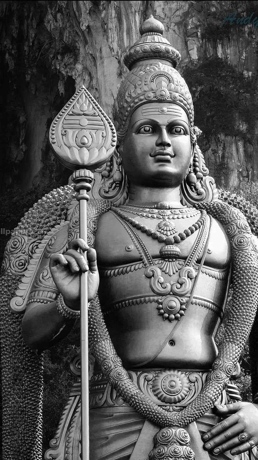 Monochrome Statue of Lord Murugan Holding a Spear in Traditional Indian Temple Style HD phone wallpaper