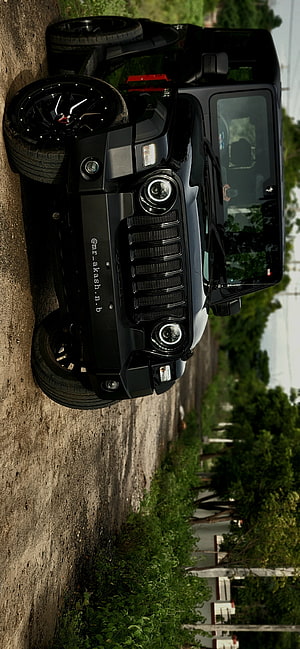 Black Mahindra Thar SUV with Custom Black Rims on a Gravel Road HD phone wallpaper