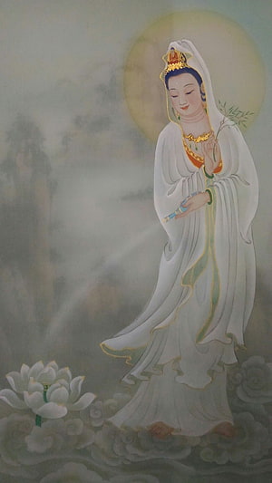 Guan Yin Bodhisattva in White Robes Standing on Clouds with Lotus Flower HD phone wallpaper