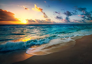 Golden Ocean Sunset Over Turquoise Waves and Sandy Shore HD wallpaper