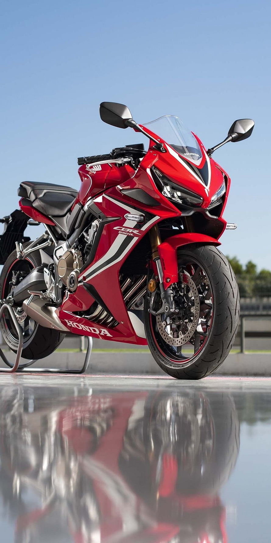 Red Honda CBR650R Sport Motorcycle Parked on Wet Asphalt with Reflection HD phone wallpaper