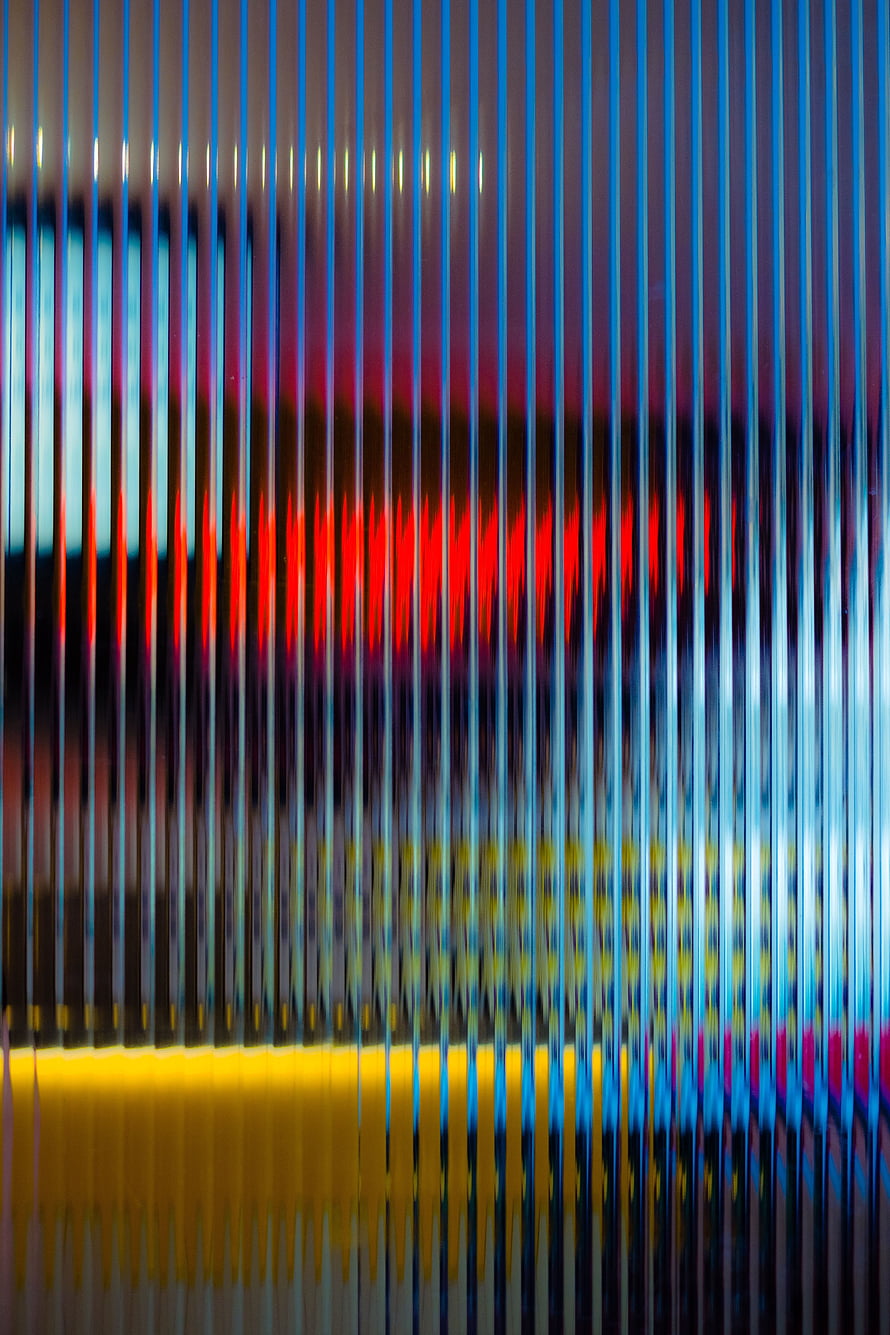 Abstract Vertical Streaks of Neon Light Through Textured Glass Surface HD phone wallpaper