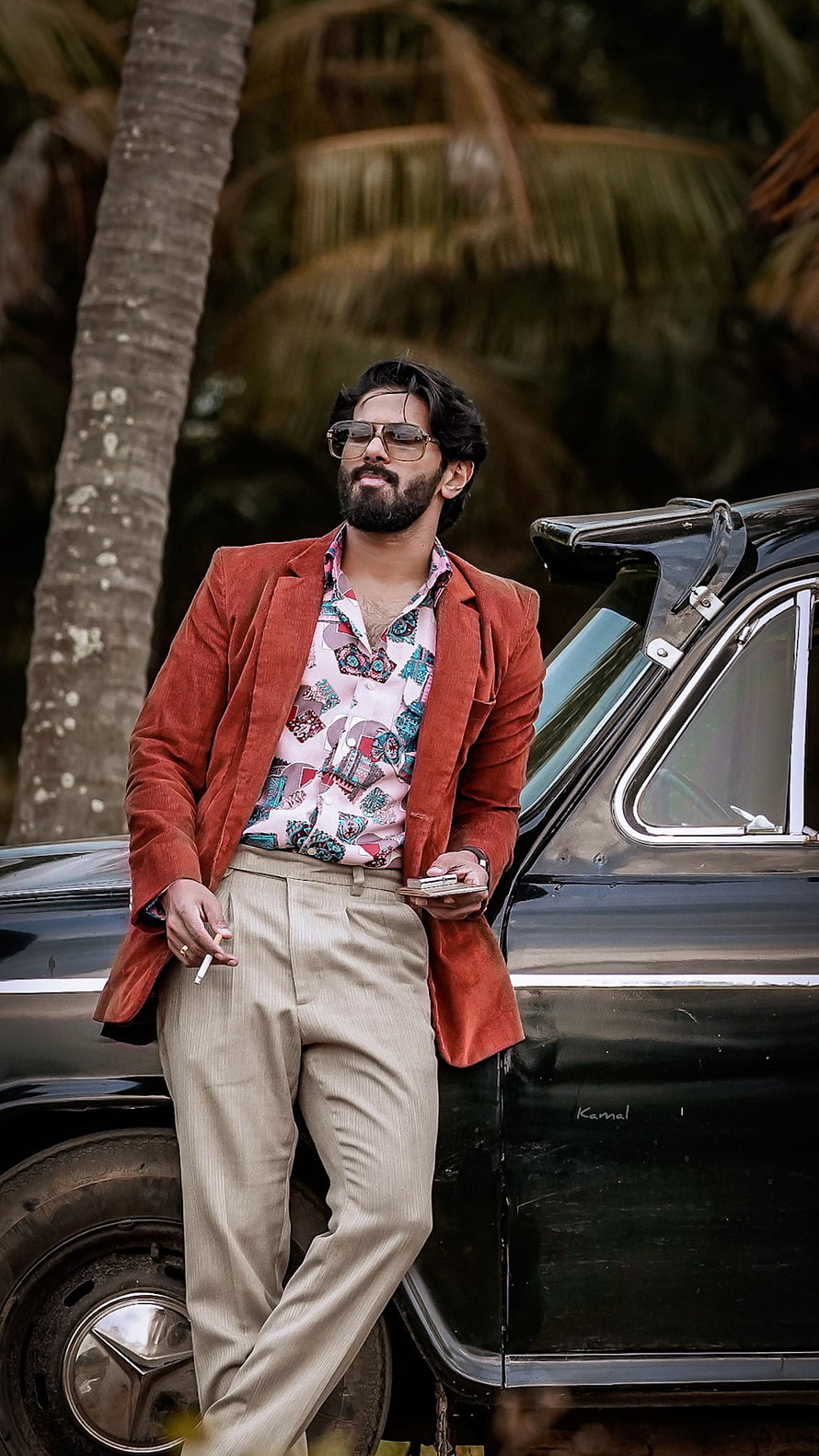 Dulquer Salmaan in Kurup Malayalam Film Still Leaning Against Vintage Car HD phone wallpaper