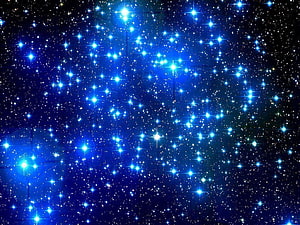 Vibrant Blue Starfield with Glowing Celestial Points and Deep Space Nebula HD wallpaper