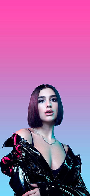 Dua Lipa in a glossy black jacket against a vibrant pink and blue gradient background HD phone wallpaper